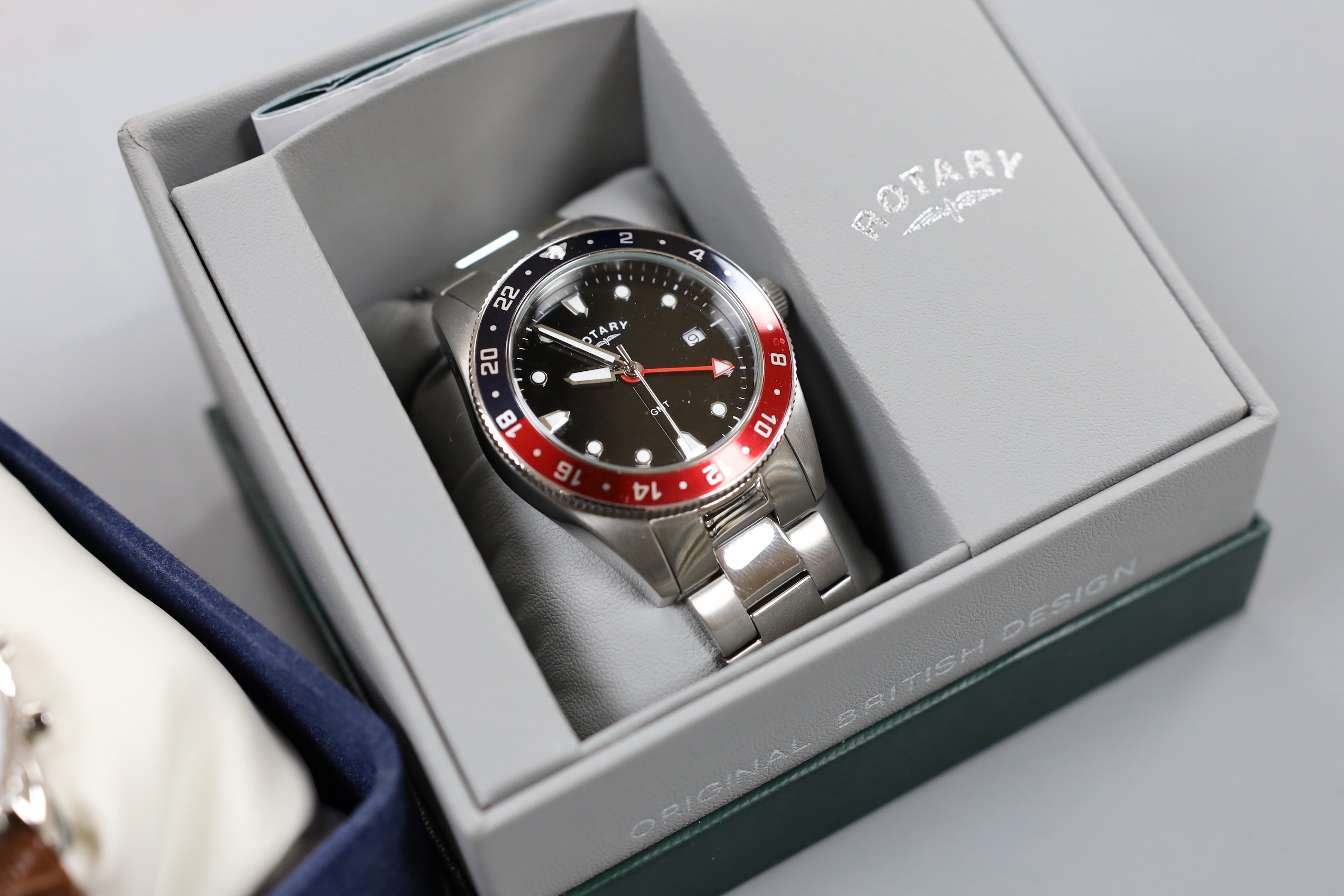 Two gentleman's modern stainless steel Rotary quartz wrist watches, model GMT and Chronospeed, both with boxes.